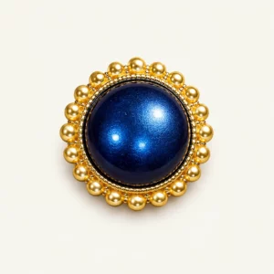 Bouton doré à cabochon bleu nuit